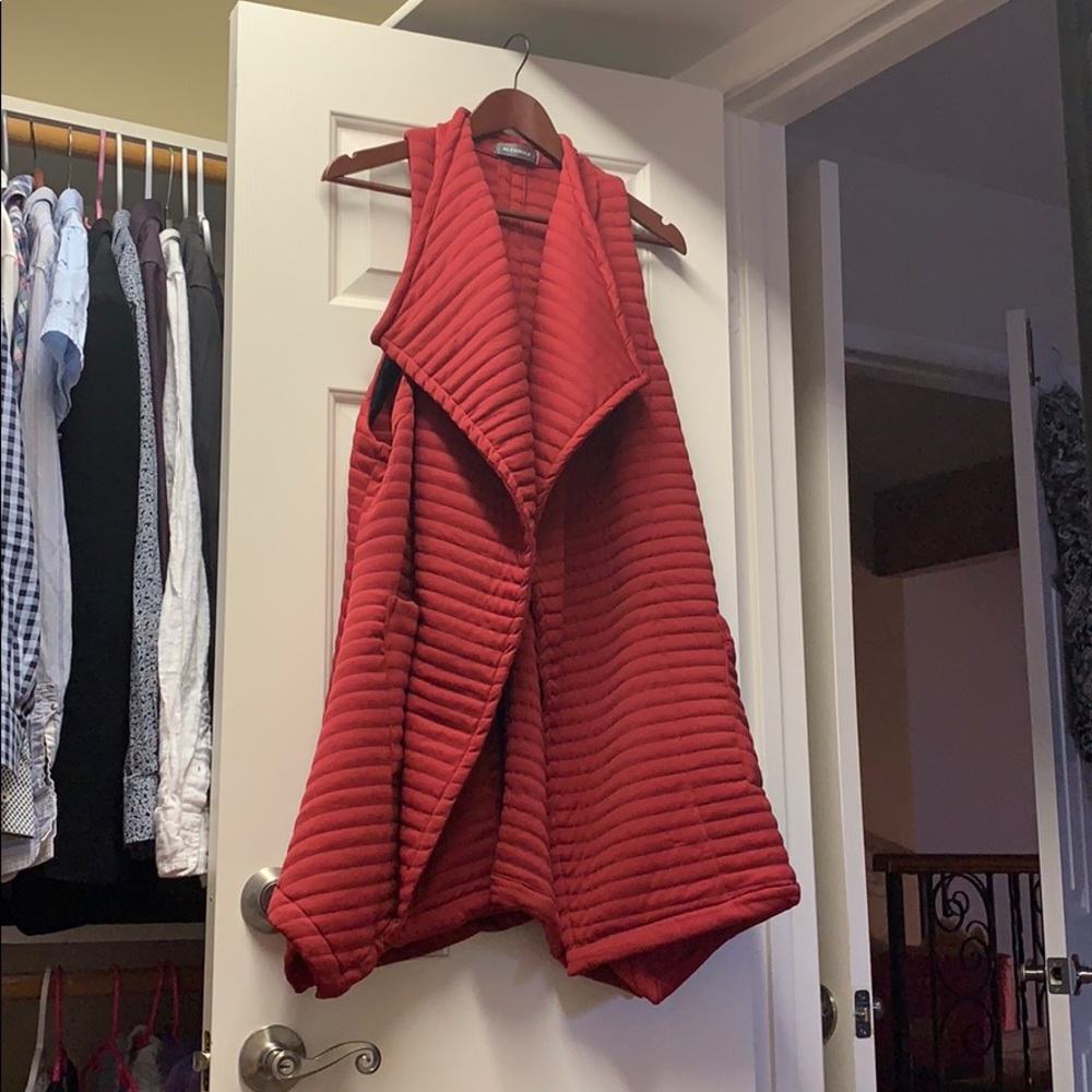 Red sleeveless duster style quilted cape